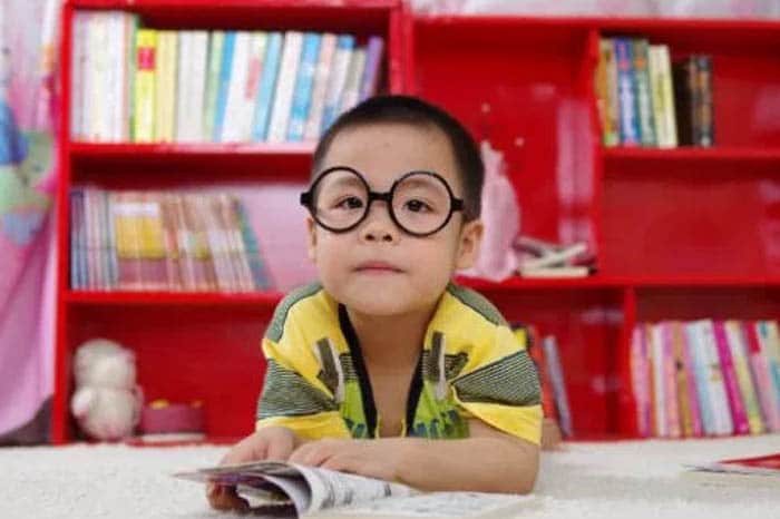 Little Boy in the Library with Eye Glasses